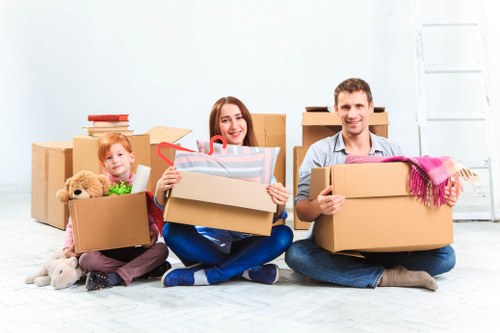 Professional movers navigating stairs in a Richmond apartment building