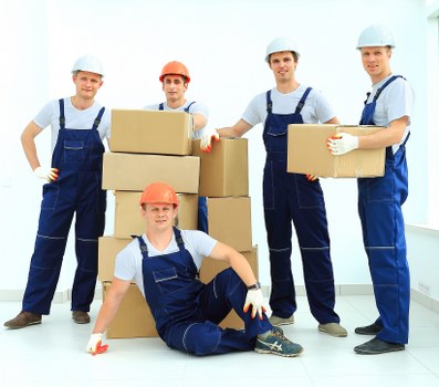 Packed moving boxes ready for transport in a Richmond home removal