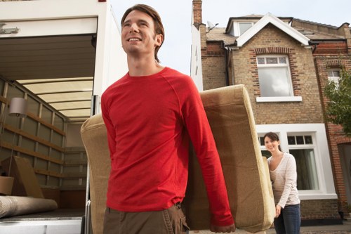 Packed boxes and furniture ready for secure storage during a local move