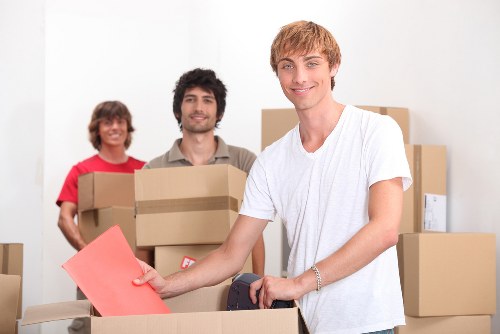 Packed moving boxes and furniture ready for transport in a Richmond home